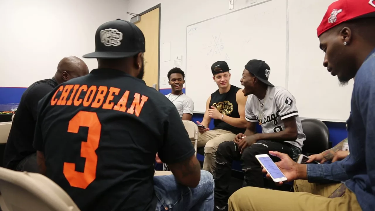 DC Young Fly and Chico Bean Play Cards Backstage At Georgia State University Wild N' Out Show