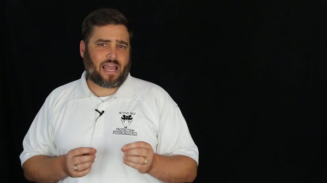 Father Holding His Child Shoots Armed...