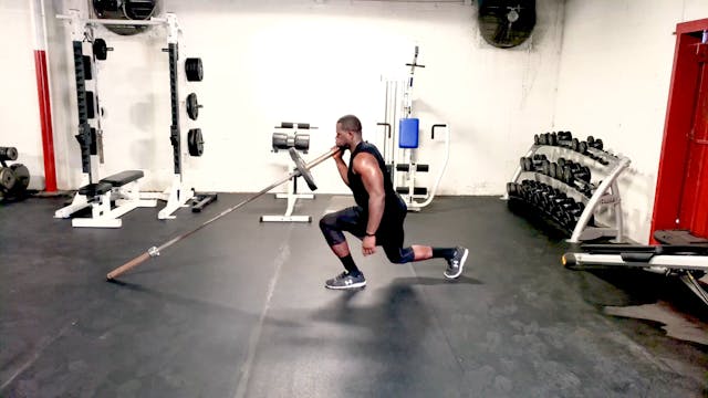 Landmine Reverse Lunge Into Press