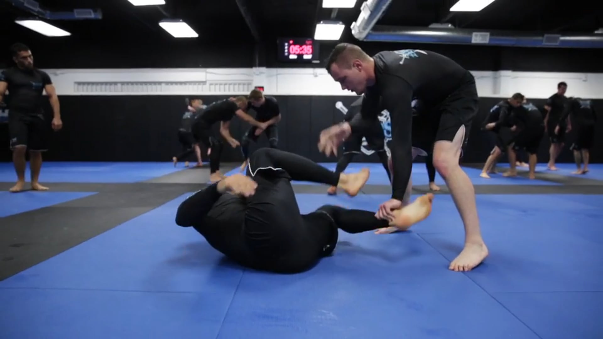 Andre Galvao Rolling Then Giving Tips to His Student Afterwards 