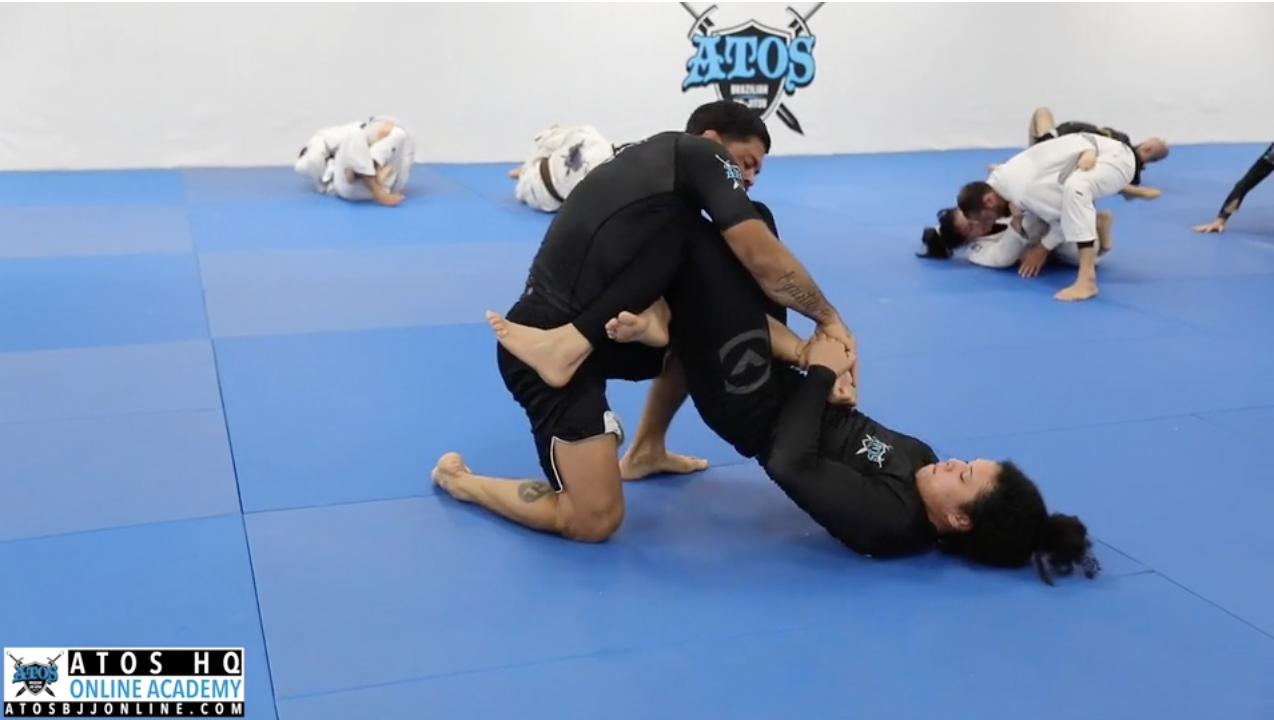 Professor Andre Galvao rolling with Rafaela Guedes 