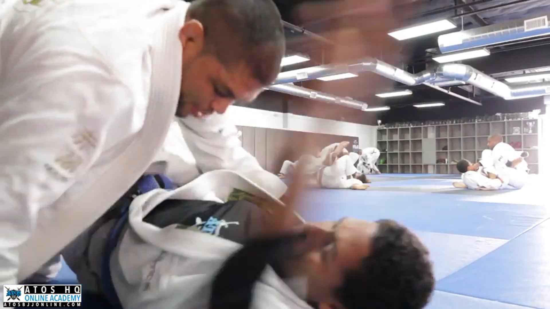 Sparring - professor Andre Galvao with a blue belt 