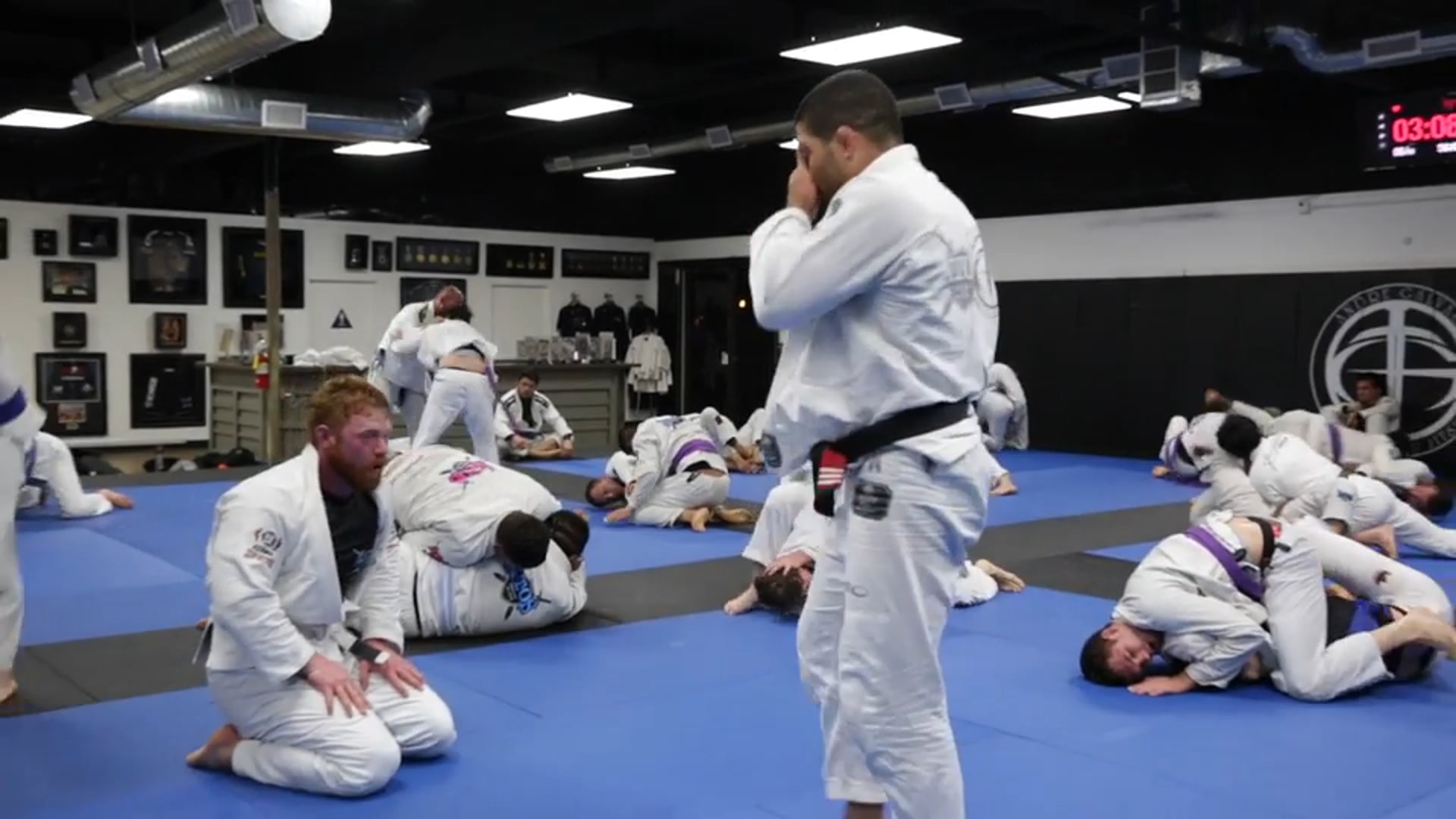 Sparring - professor Andre Galvao with a white belt