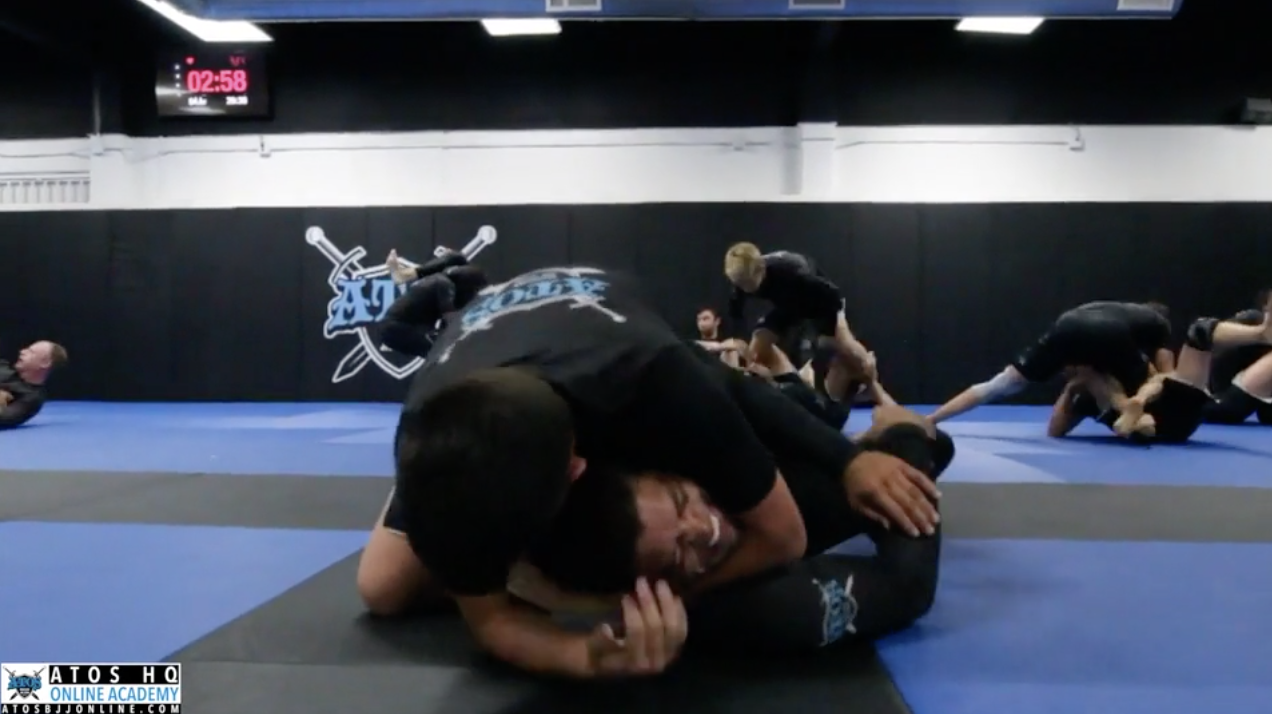 Andre Galvao Rolling With One of His Yellow Belt Students 