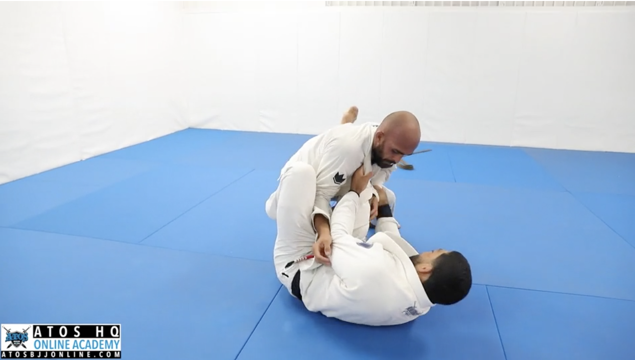 Professor Andre Galvao rolling with his brown belt student Thiago Calixto