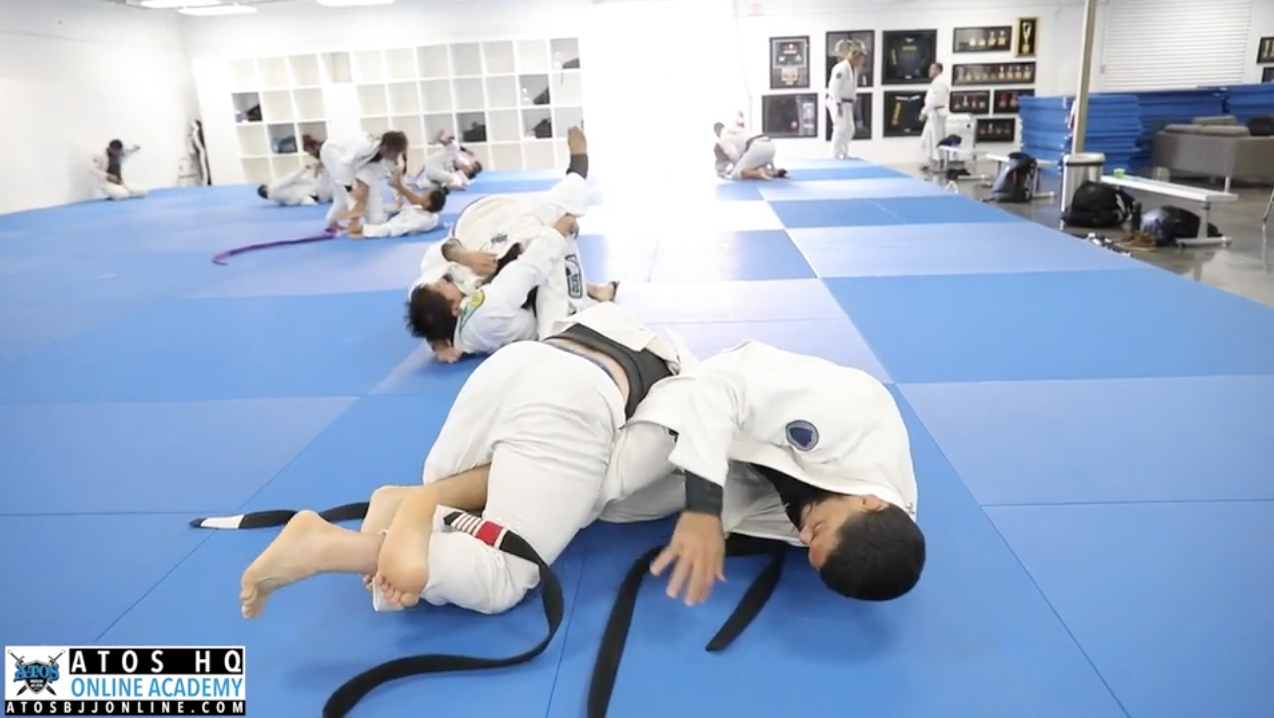 Professor Andre Galvao rolling with his black belt student Brian Frias