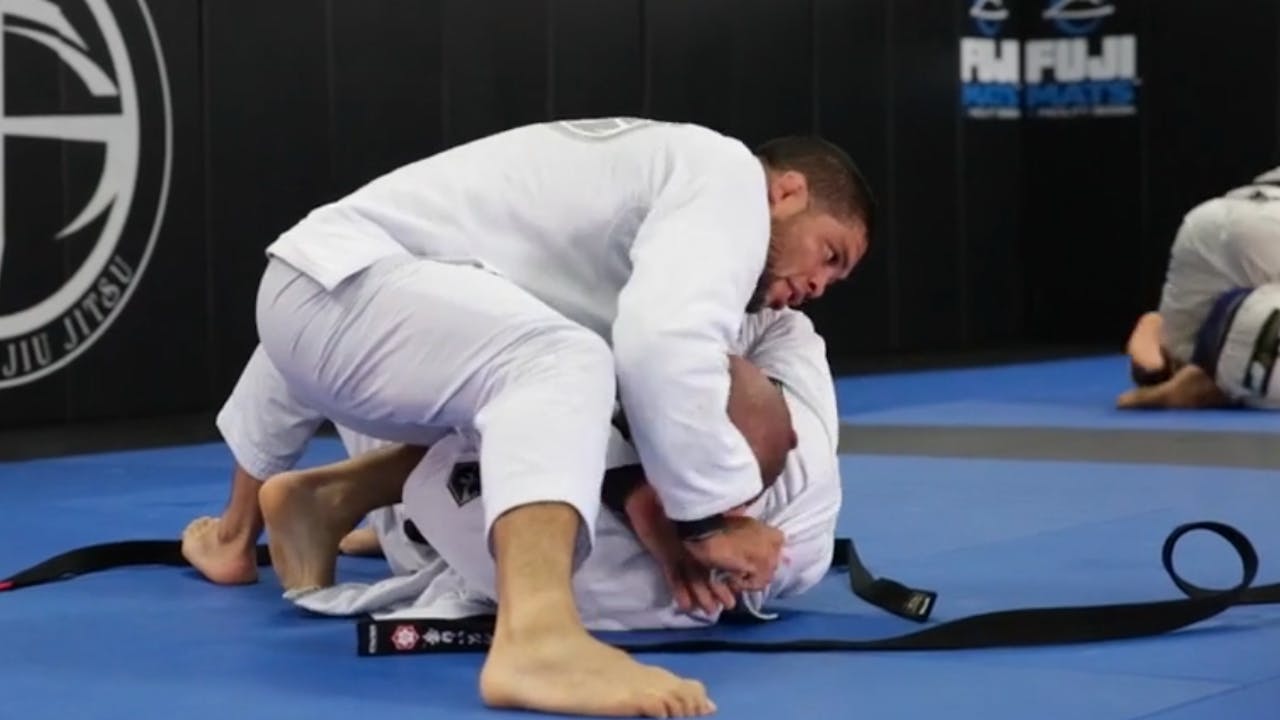 Professor Andre Galvao rolling with a blackbelt Andre Galvao Atos