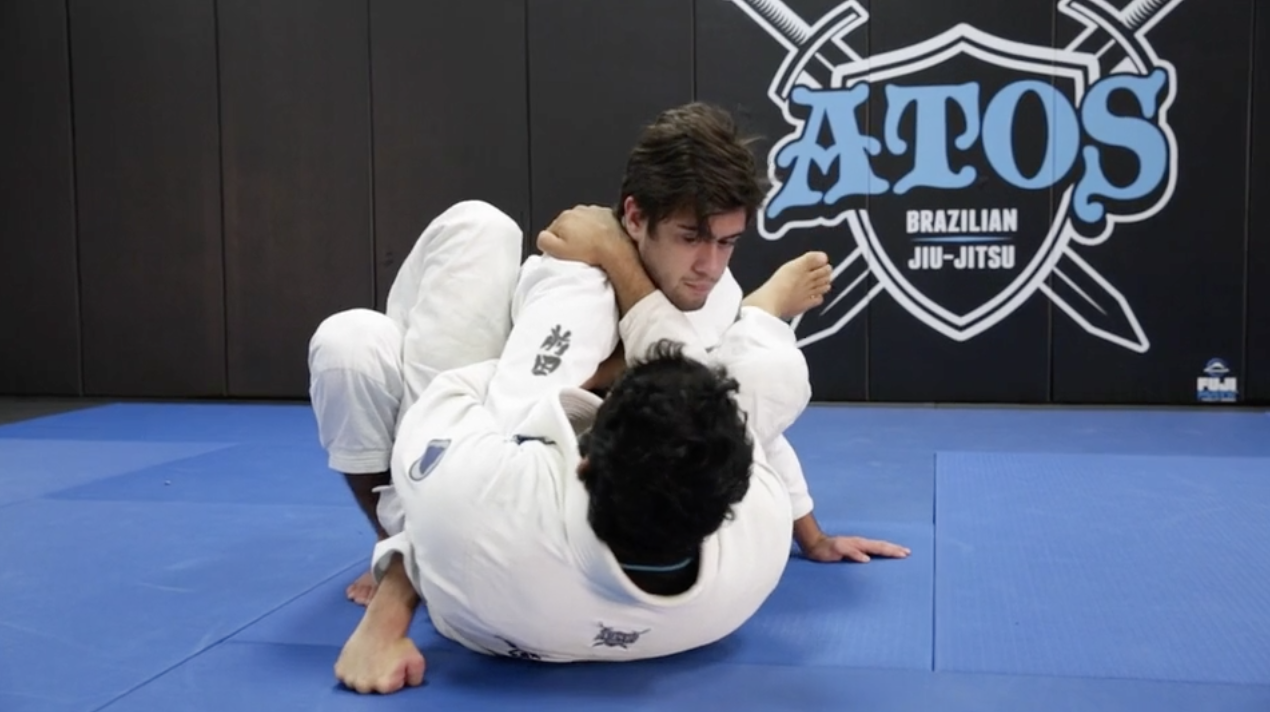 Using the Whizzer Arm Control to Set Up the Omoplata From the Closed Guard 
