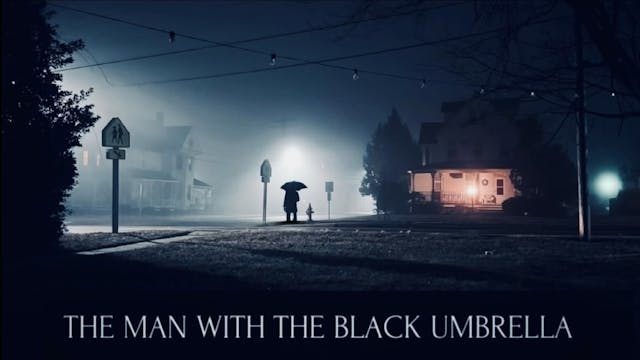 The man with the black umbrella