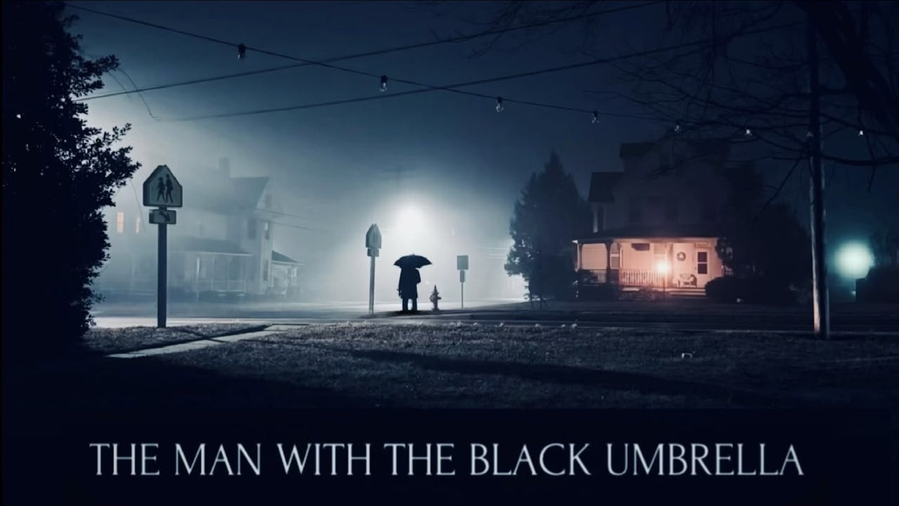 The man with the black umbrella