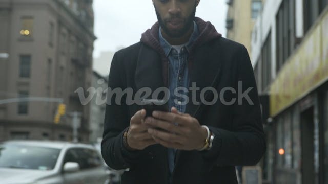 Dolly shot of man using smart phone w...