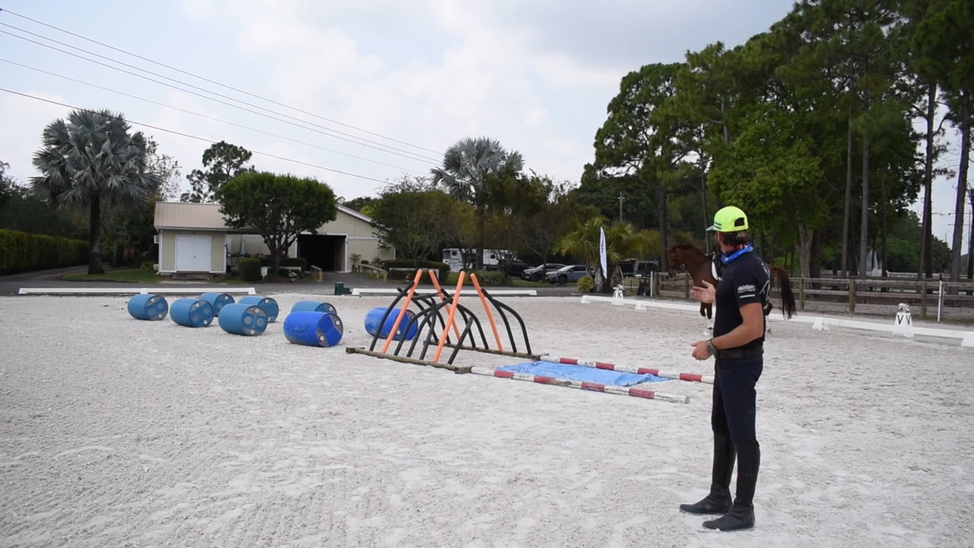 Jessica under saddle with obstacles and two tempies