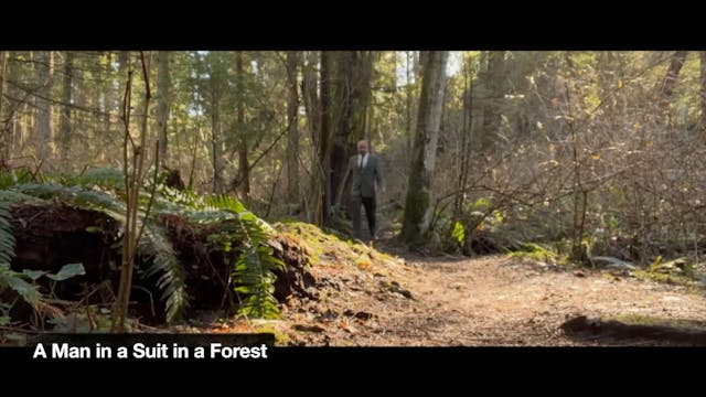 A MAN IN A SUIT IN A FOREST short fil...