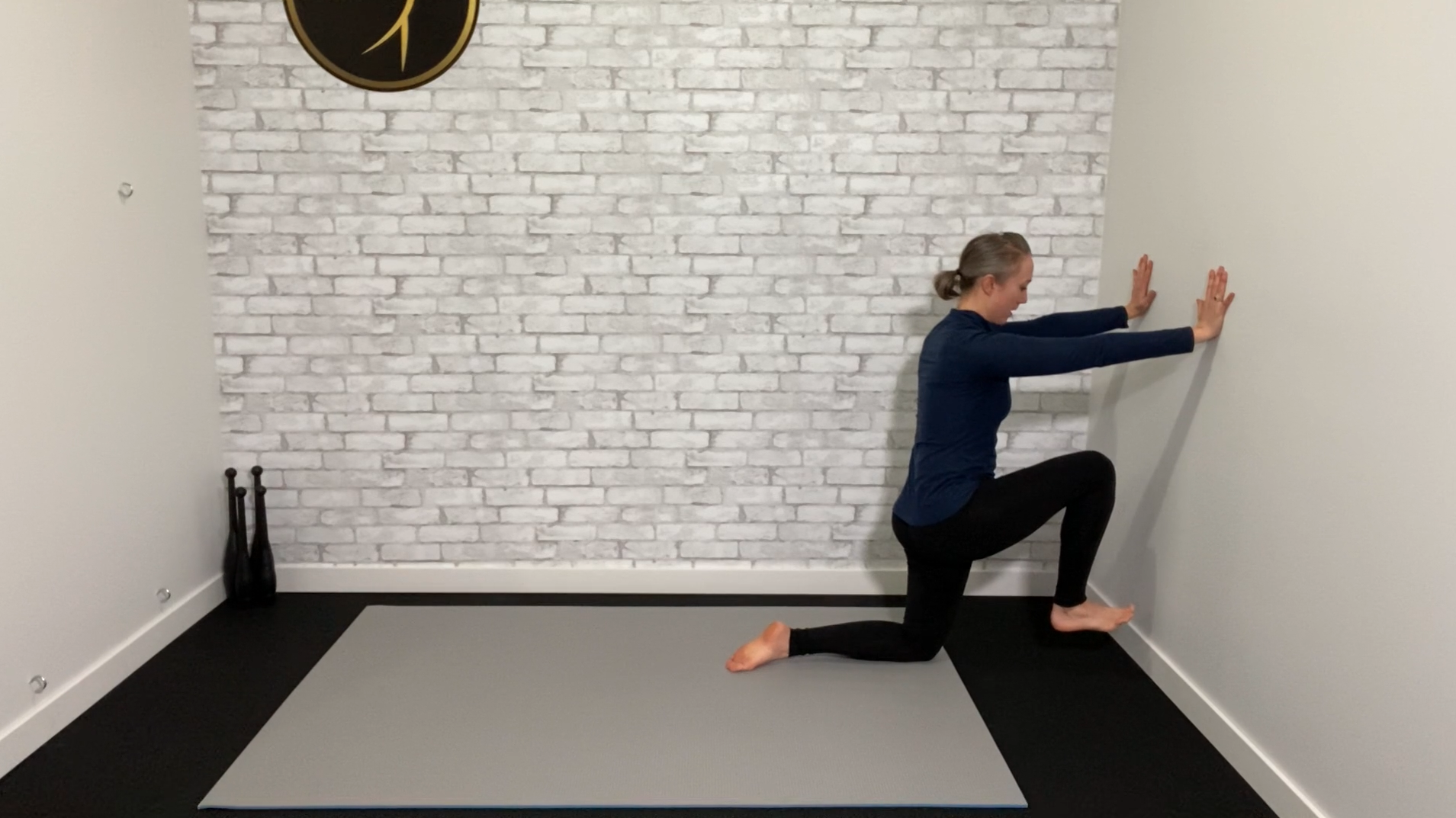 Tall kneeling hip CARs against the wall