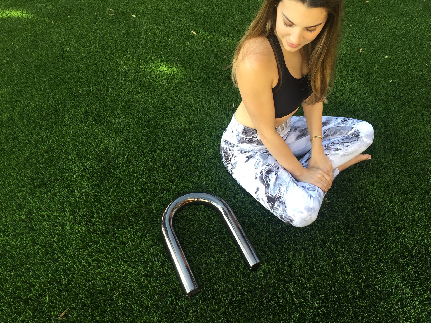 Outdoor Yoga stretch using the Ubarre. 