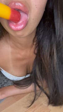 Licking a long popsicle sensual hot