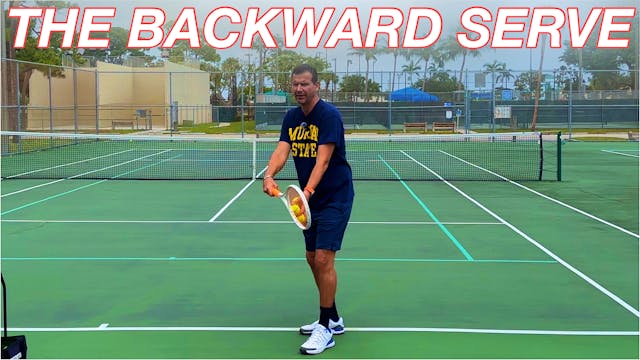 The Backward Tennis Serve