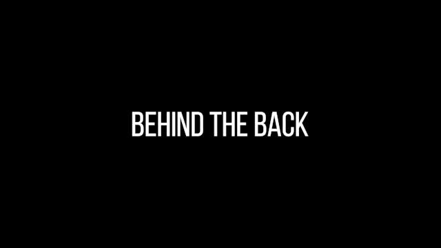 Behind the back