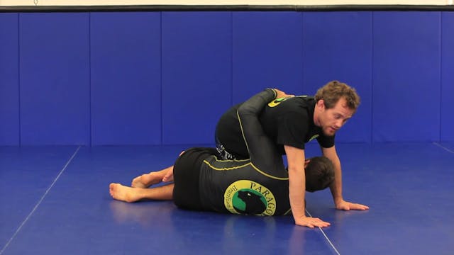 Passing half guard to guillotine choke in jiu jitsu