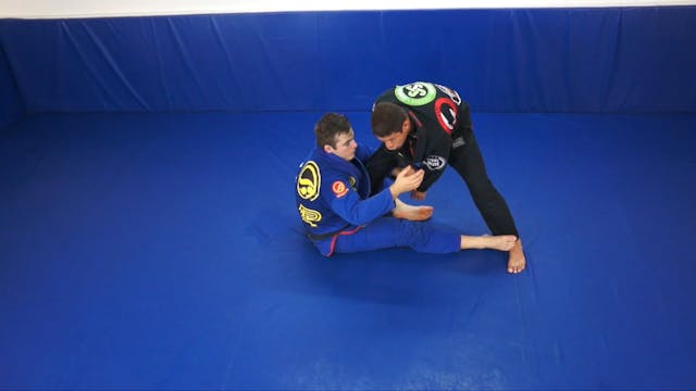 Seated guard with arm trapped sweep