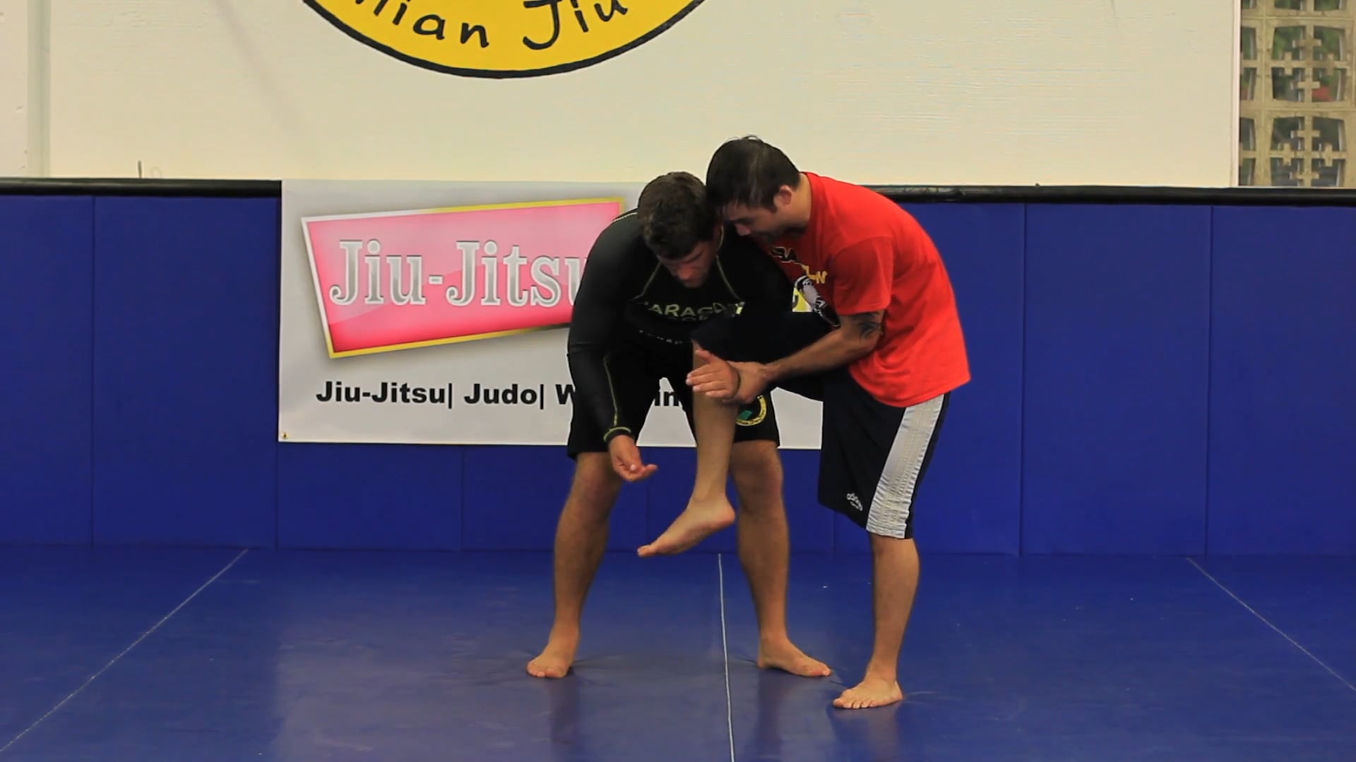 Single leg roll thru reversal in wrestling