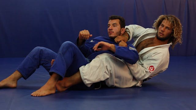 Arm drag to unique lapel choke