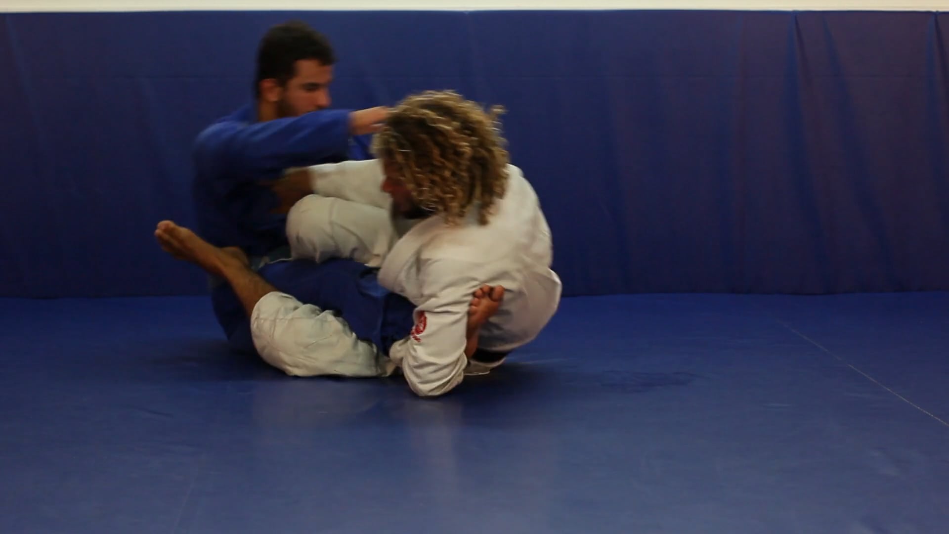 Scissor sweep to foot lock from the half guard