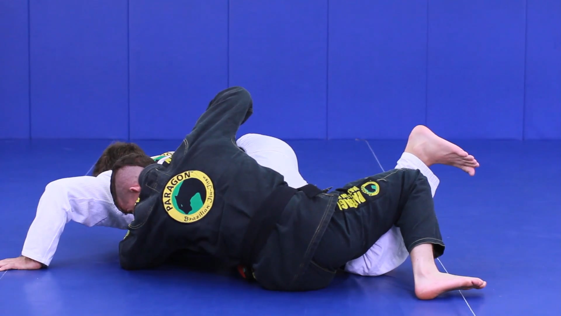 Belt control duck under sweep from butterfly guard