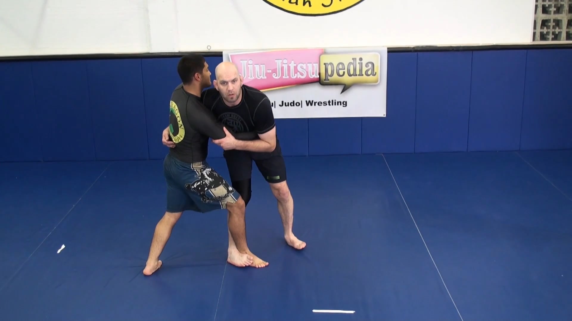 Leg trip combination from the over under 50/50 in wrestling