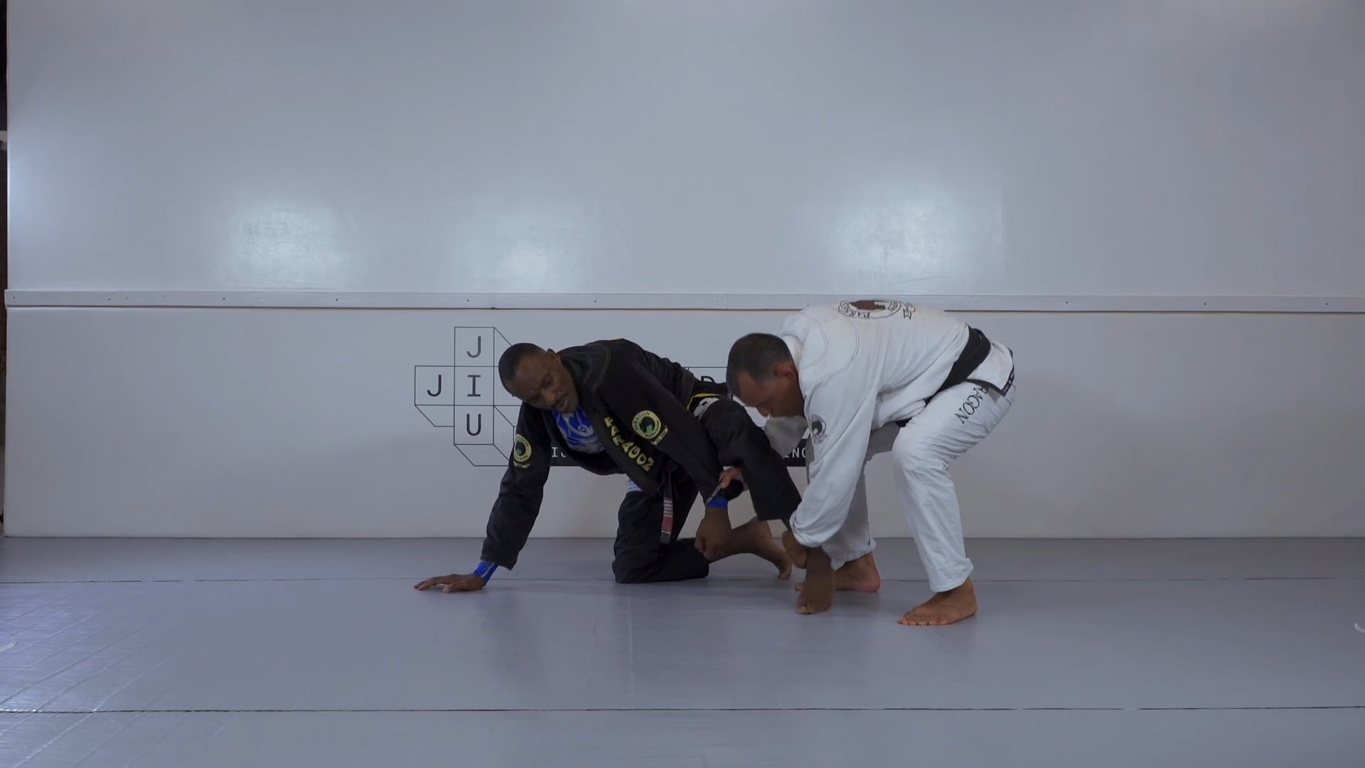 Breaking posture and setting up seated guard