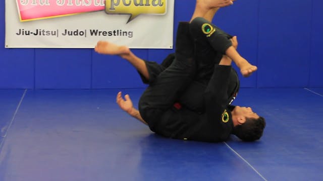 Half guard sweep using a back roll