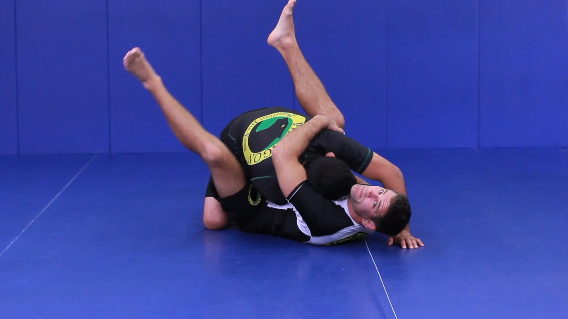 Arm drag to axe sweep from closed guard