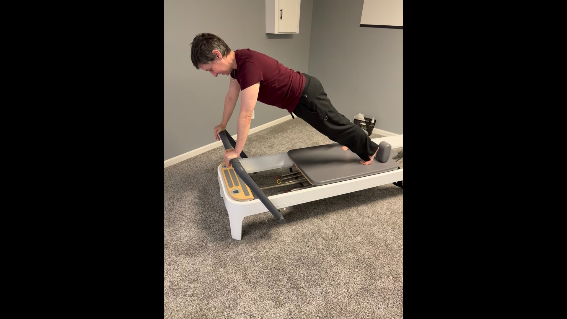 Plank ( Long Stretch) on the reformer