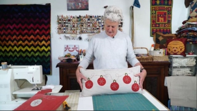 Red Baubles Cushion with Anne Baxter