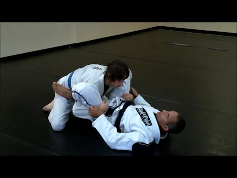 Defending the underhook passing guard with a shoulder lock