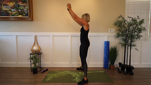 Squat with Single Dumbbell Chest Push