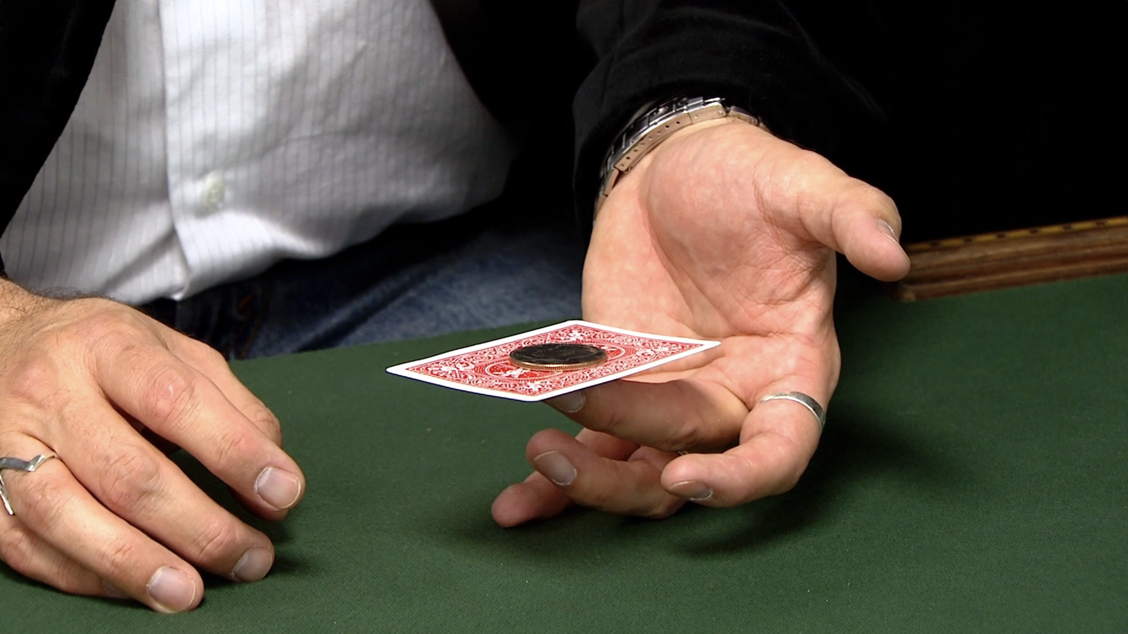 Flicking a Card Out from Beneath a Coin