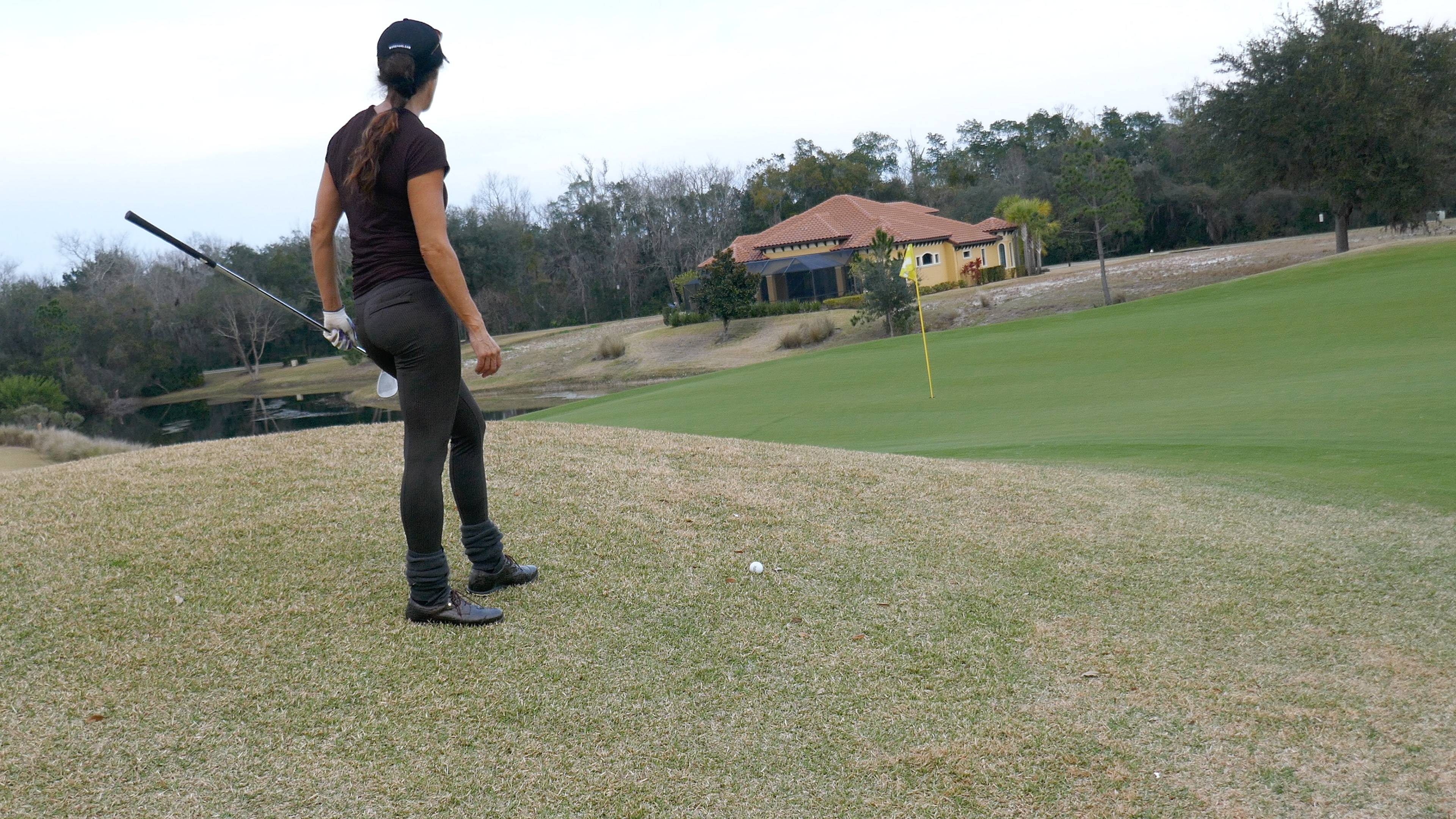Ball Below Feet to Downhill Green