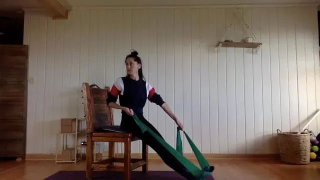 Pilates class with a chair and a band