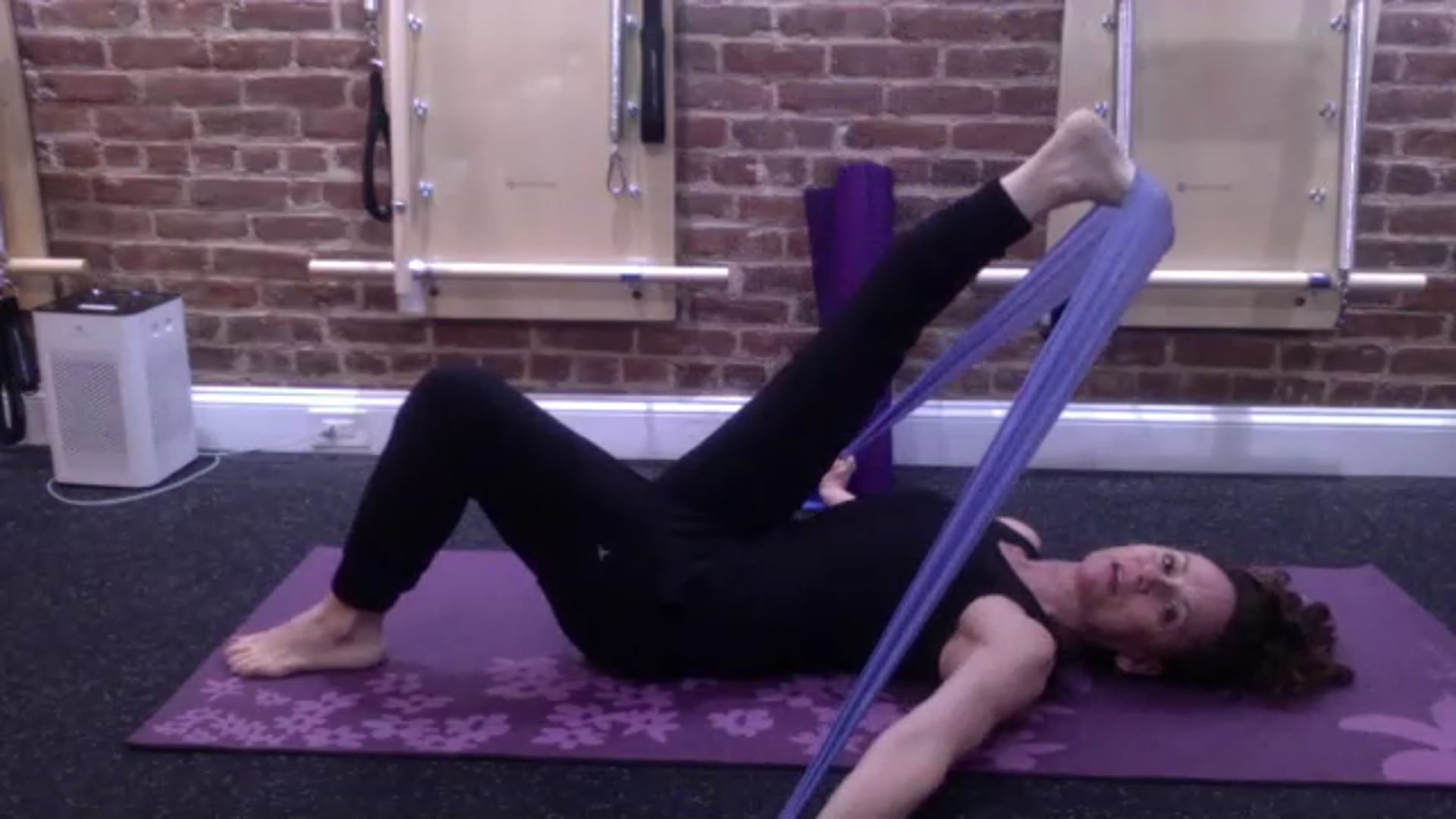 Pilates Mat Utilizing the Theraband with Patricia