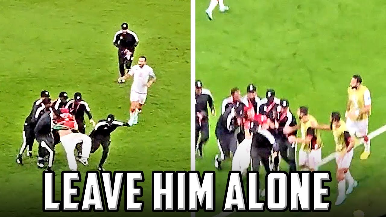 TEAM DEFENDS PITCH INVADER IN QATAR