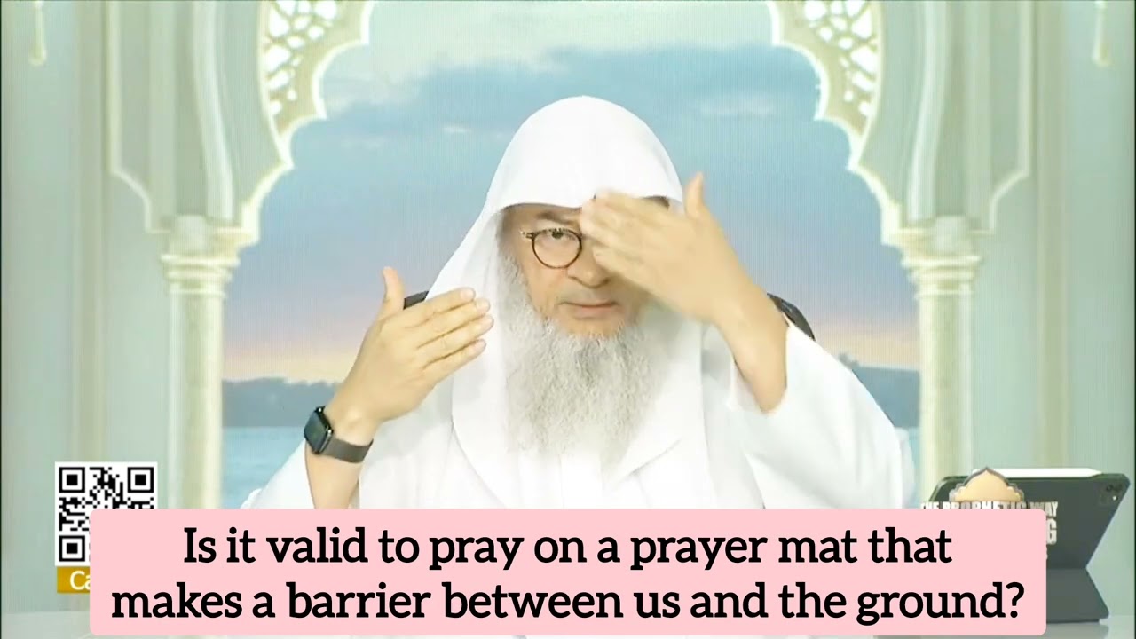 Is prayer valid on prayer mat that makes a barrier between my forehead & ground