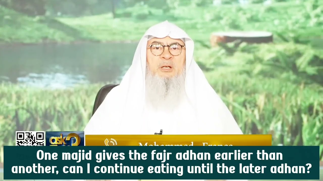 One Masjid gives fajr adhan earlier than the other, Can I continue eating?