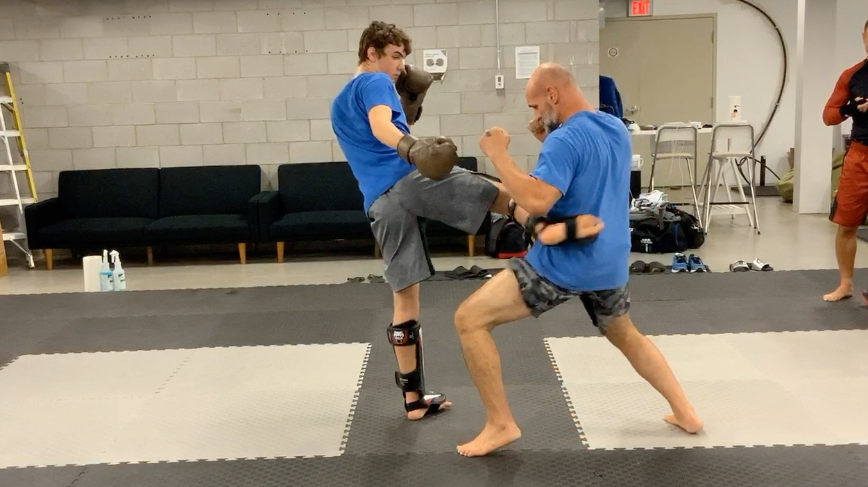 Muay Thai Fundamentals White Shorts:Stripe 2-Lesson 2 Defence vs the low kick
