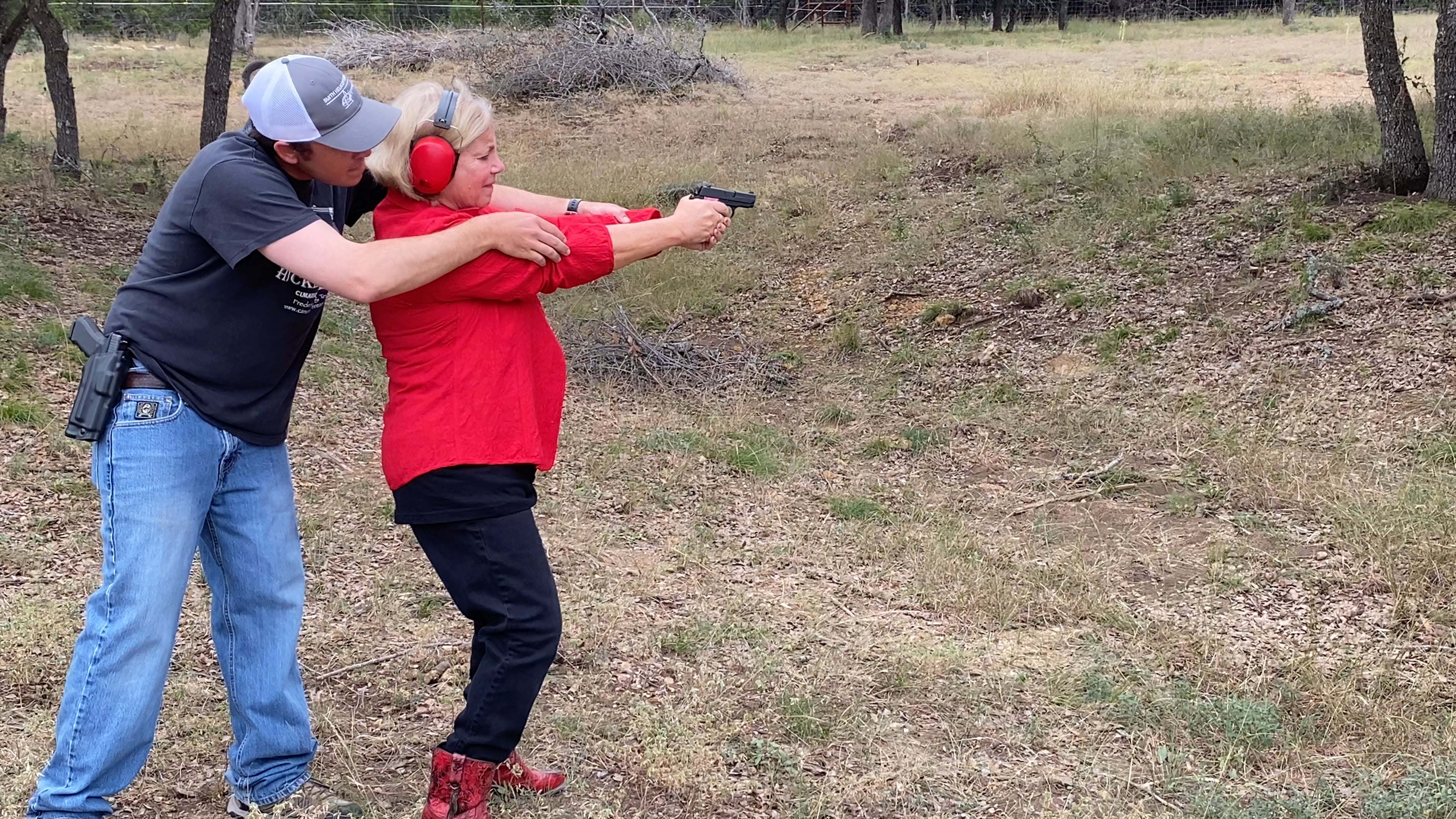 Lady in red on the shooting range
