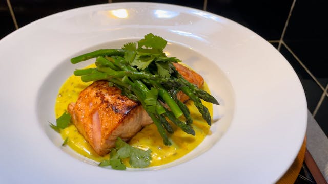 Salmon in a creamy turmeric sauce wit...