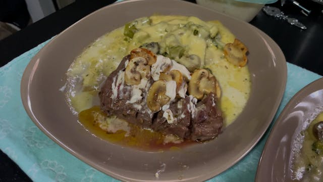Steak with broccoli and mushroom sauce