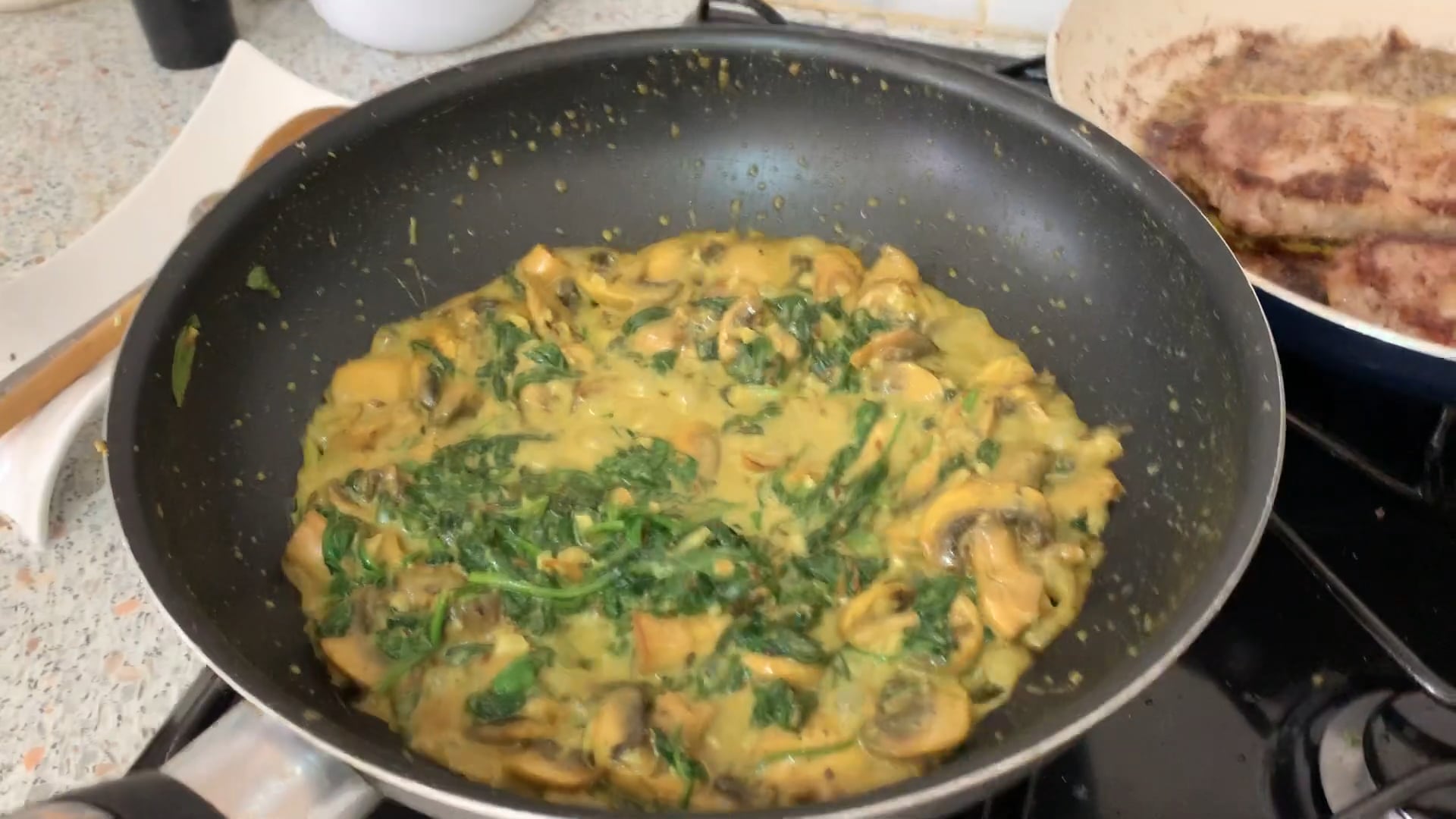 Curry Spinach with mushrooms and chick peas served with a Veal steak