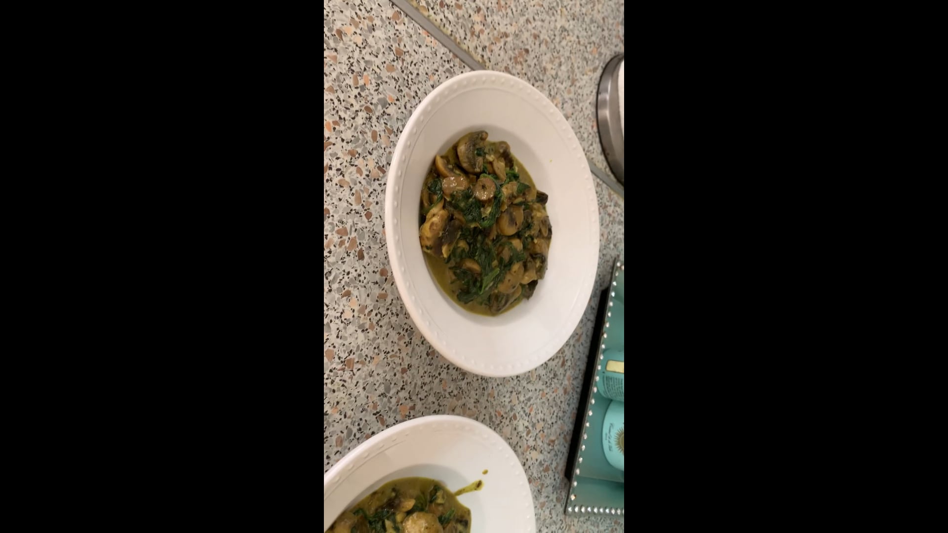 Sautéed mushrooms with spinach and on top the veal steak