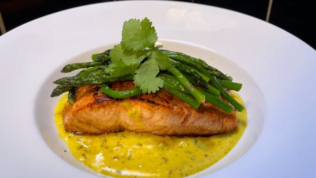 Salmon in a creamy turmeric sauce wit...